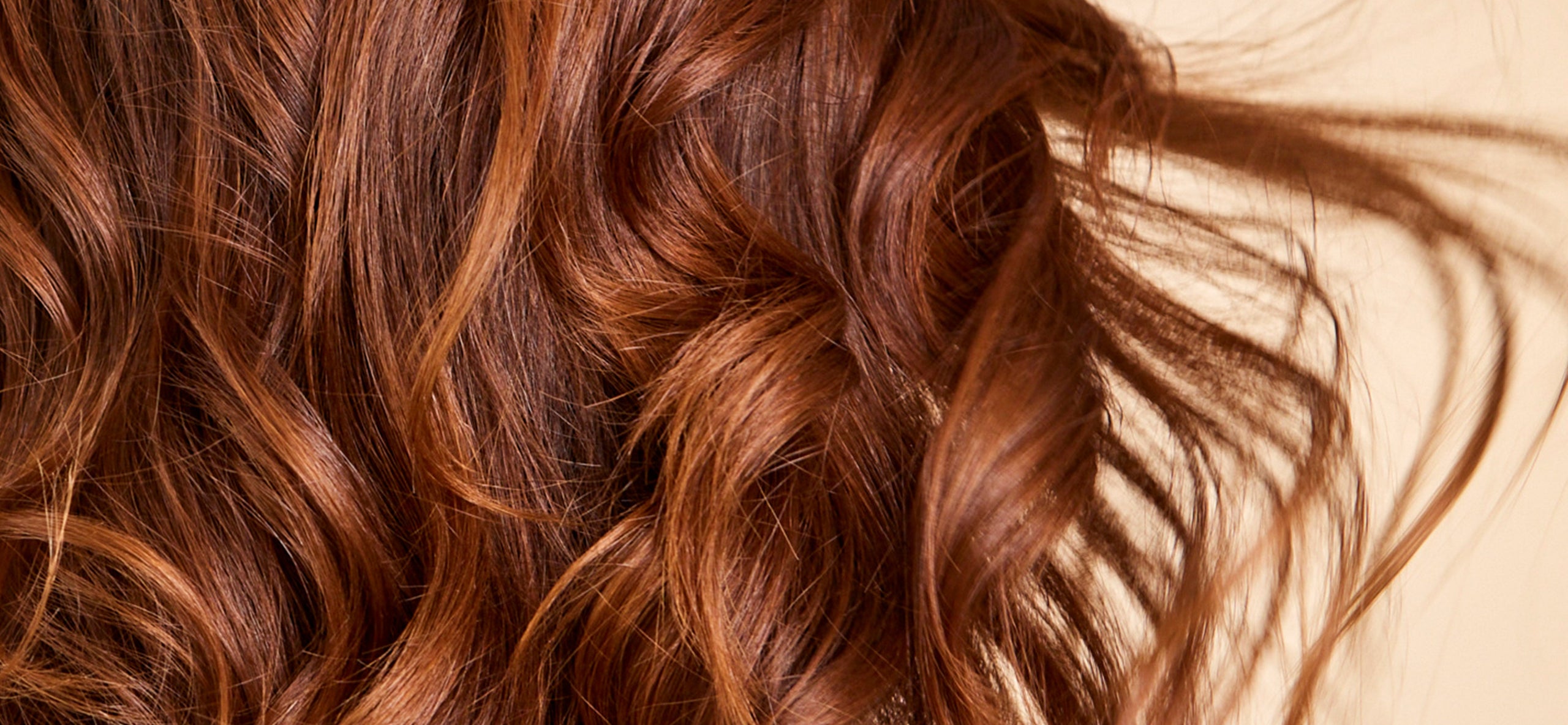 Image of brown hair dyed with natural plant-based hair color by khadi