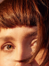 Image of a model after using golden brown plant based hair color by khadi