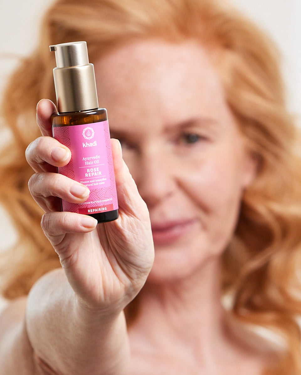 Image of Rose Conditioner, model holding the product