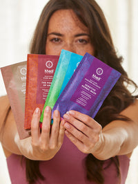 a model presents khadi natural hair mask packaging