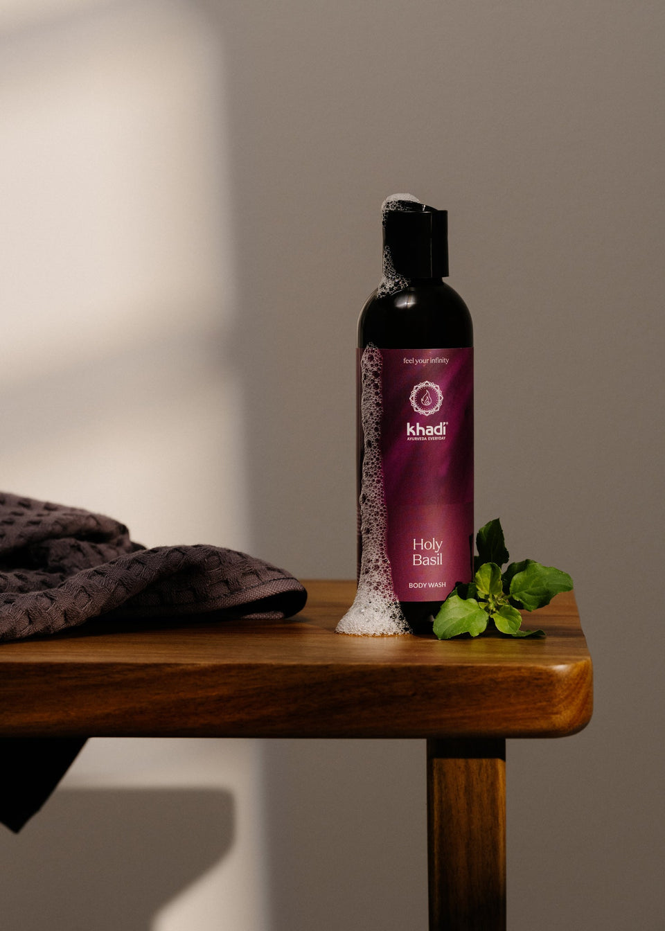 Creative still life of Ayurveda Everyday Holy Basil Bodywash – an aromatic experience for body and mind.